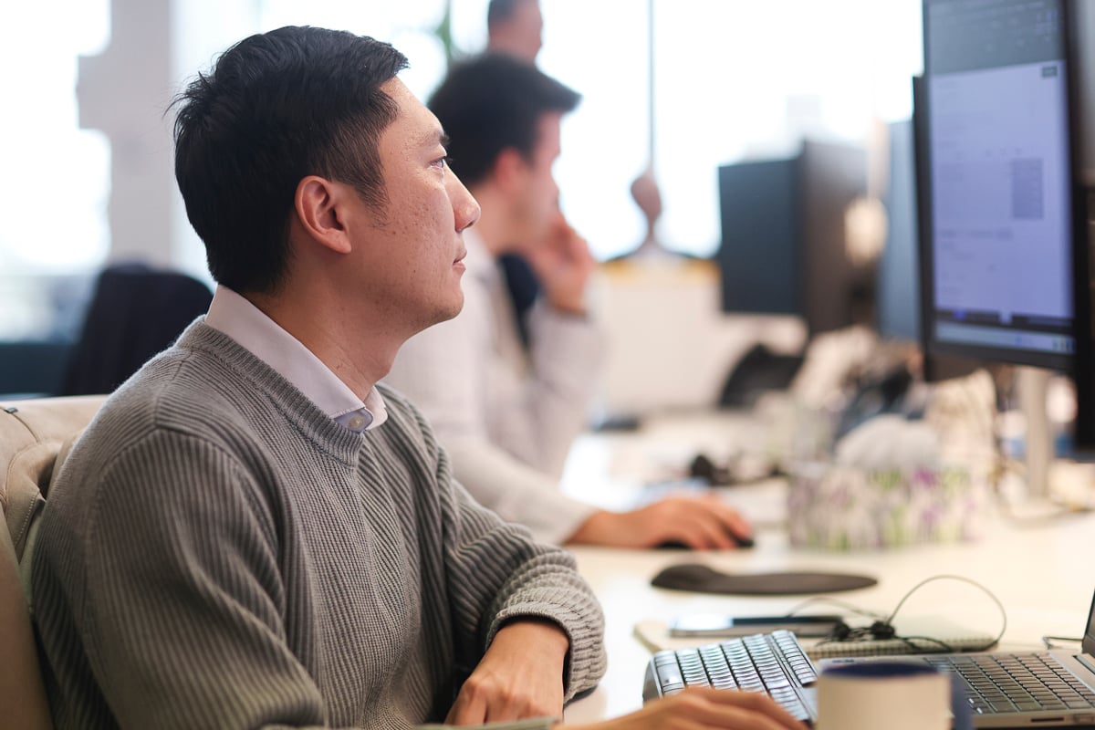 A Prime Partners accountant working at a desk