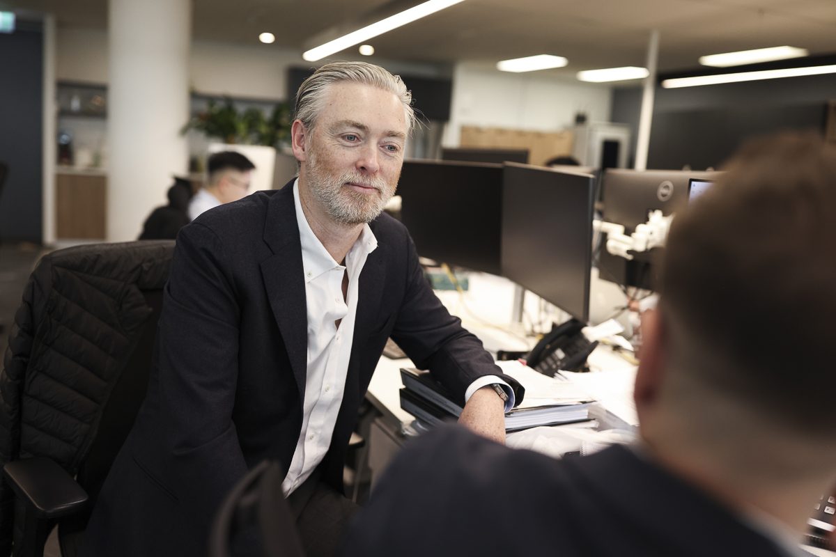 James Carey talking with a client in the Prime Partners office