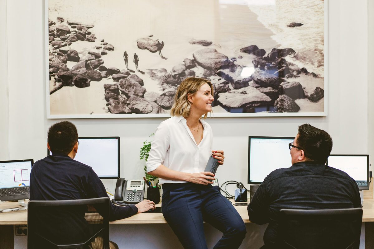 The team collaborating at their desks